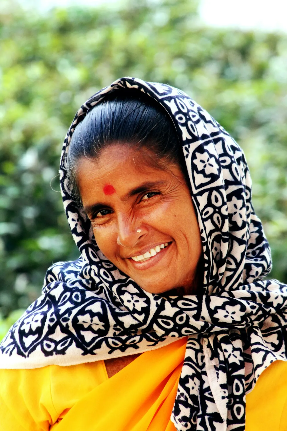 Smiling woman in a printed scarf